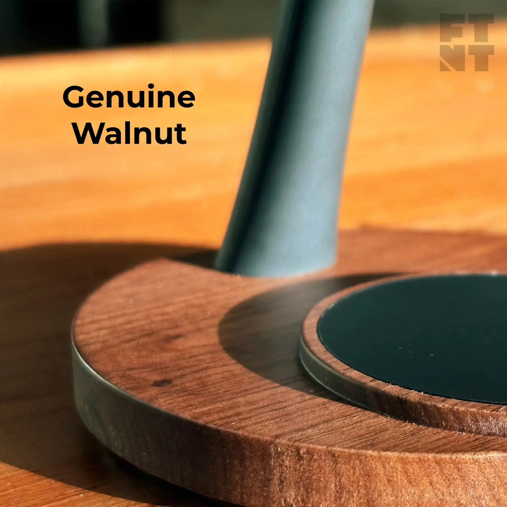 Close-up of the ZenStand 3-in-1 wooden MagSafe charger with power adapter, featuring a genuine walnut base.